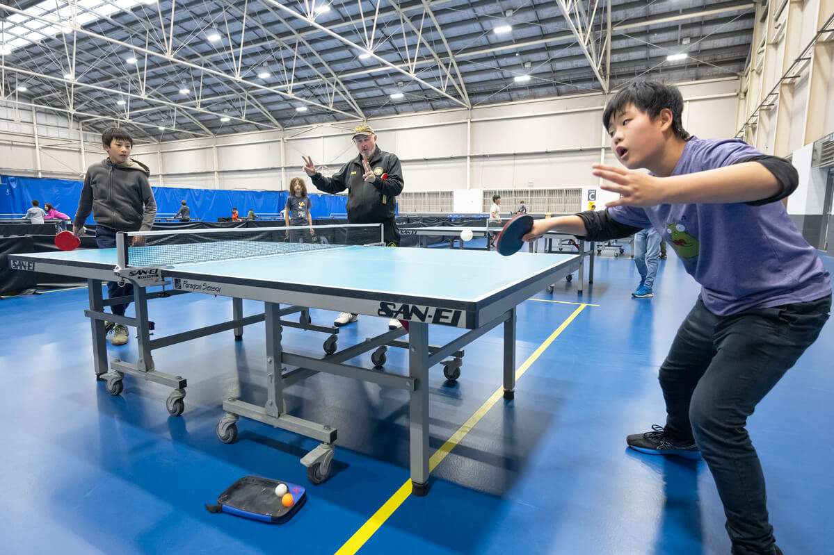 Team playing table tennis